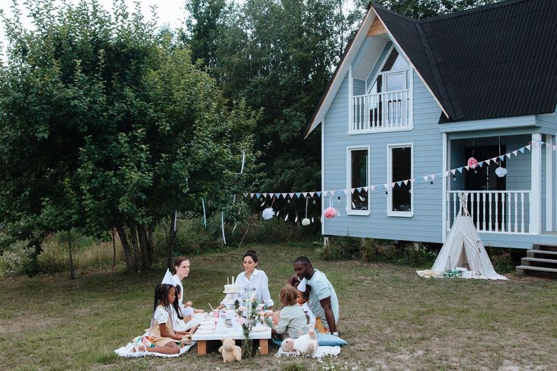 A housewarming for thirty in a house with one sofa
