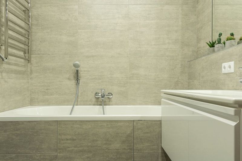 Re-grouting and re-sealing the bath for £19